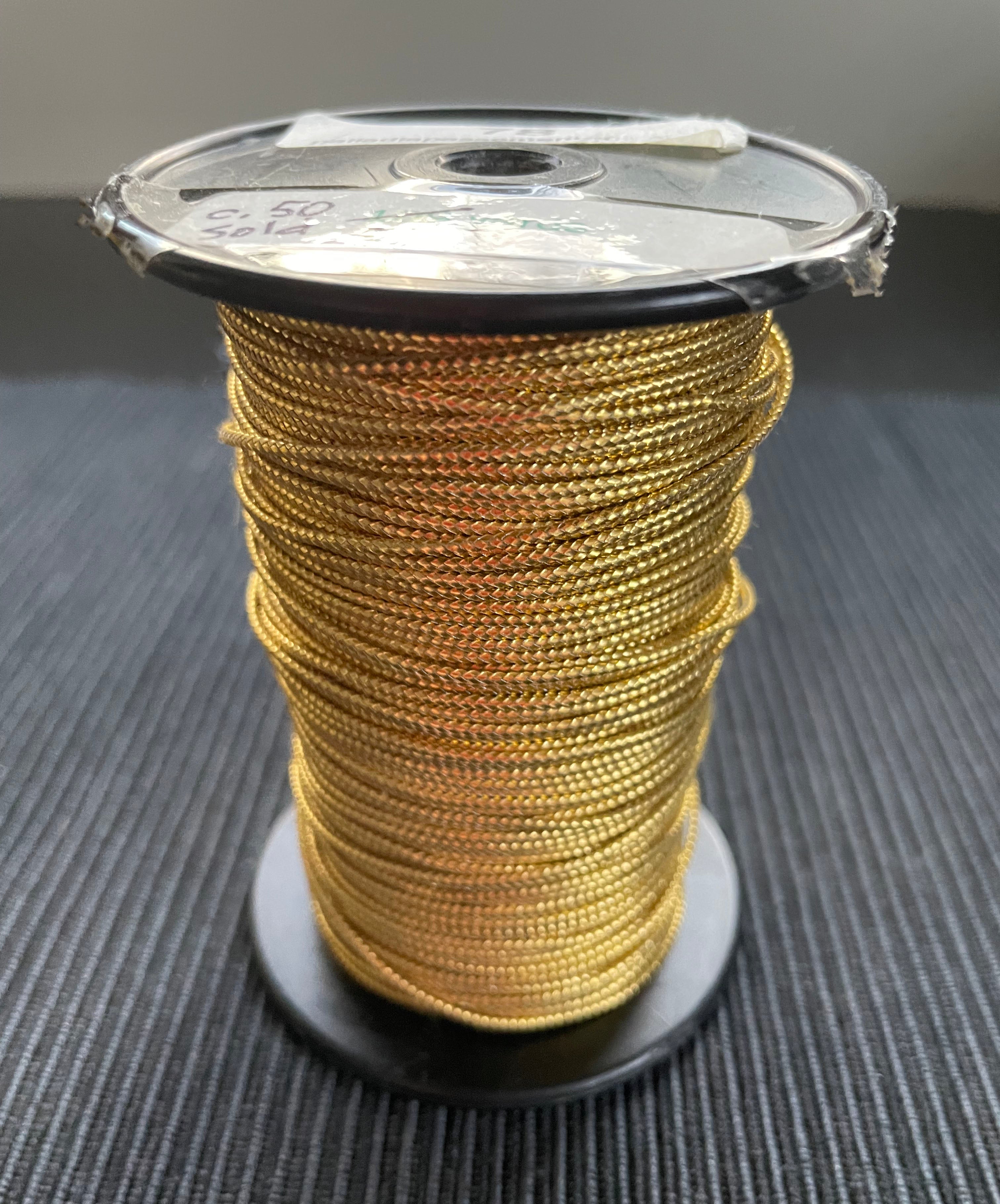 78.1 REMNANT spool - SOLD AS-IS - gold cord 1/16"